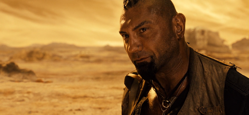 Dave Bautista as Diaz from Riddick smiling in desert