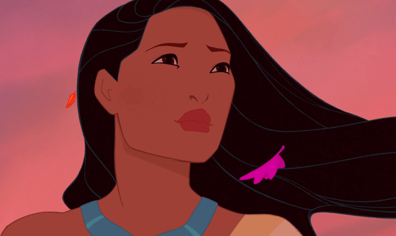 Pocahontas smiling gently with a pink sky behind her.
