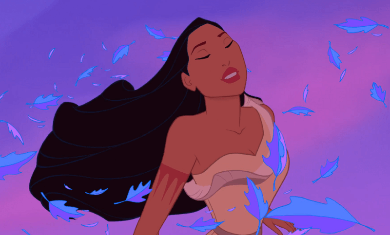 Pocahontas with her eyes closed and enjoying the blue leaves and wind blowing around her.