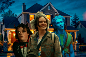 Dave smiling with Oscar and Cameron behind him as the worst Halloween characters.