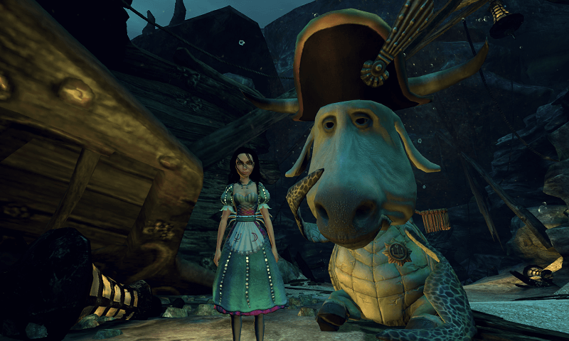 Mock Turlte looking sad while Alice stands infront of him underwater.