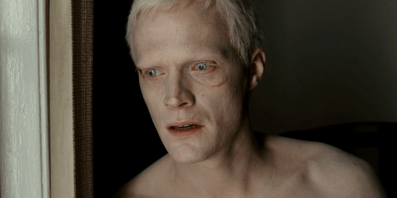 Paul Bettany as Silas with white hair and pale skin looking worried.