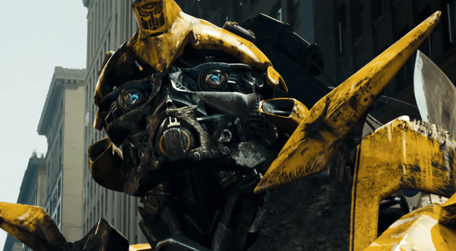 Bumblebee looking up into the sky with war damage in Transformers 2007.
