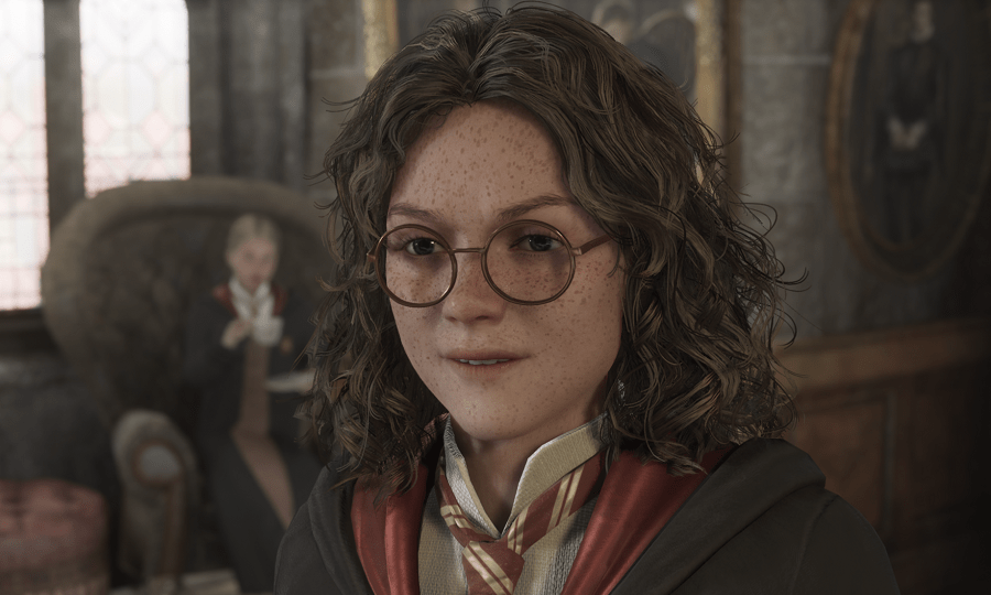 Cressida Blume joyfully speaking in the Gryffindor common room with a girl drinking tea behind her.