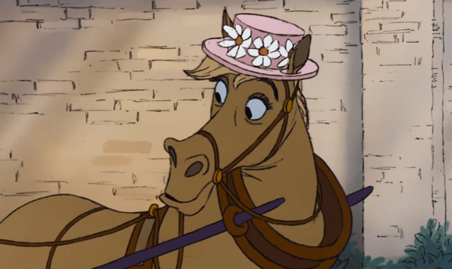 Frou-Frou brown horse with a pink hat with flowers on it.