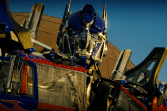 Optimus Prime looking down at something with a serious look.
