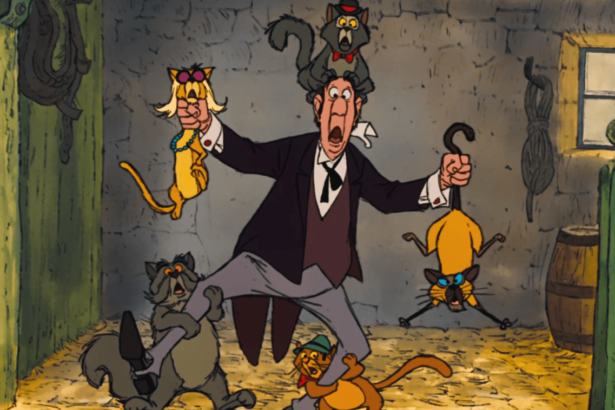 Old butler holding a bunch of cats and looking shocked in The Aristocats.