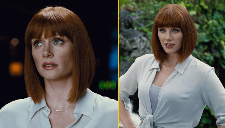 Bryce Dallas Howard as Claire in Jurassic World with red hair and white clothes looking sassy with hands on her hips.