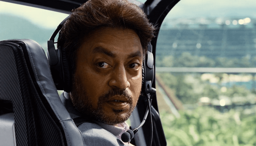 Irrfan Khan wearing a Helicopter headset while looking over his shoulder in Jurassic World.