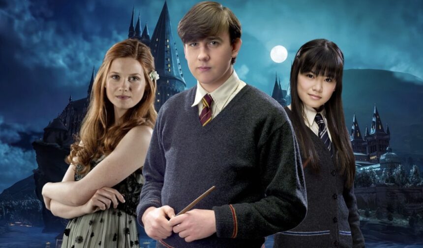 Neville Longbottom next to Ginny Weasley and Cho Chang in front of Hogwarts.